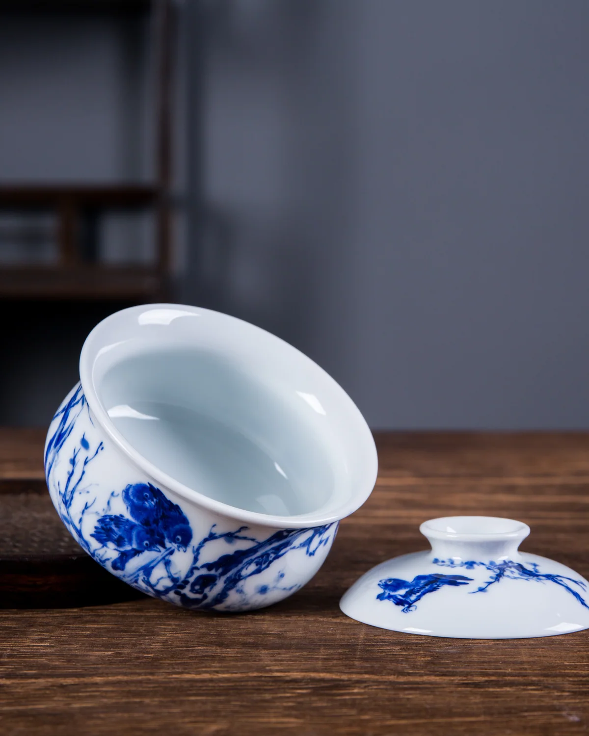 Interior of a blue-and-white covered tea vessel and its lid